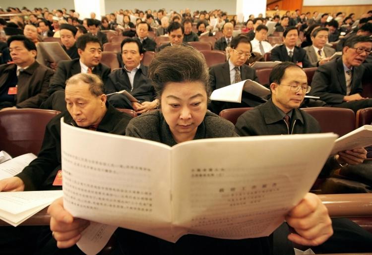 This file photo shows Communist Party delegates attending the opening session of the National People's Congress (NPC) in Beijing, an annual event for one of the world's largest rubber-stamp legislatures. China's National Audit office uncovered over 4 bill (FREDERIC J. BROWN/AFP/Getty Images)